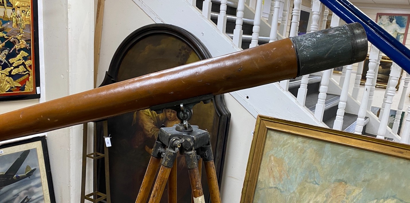 A Broadhurst Clarkson telescope with leather outer cover on folding tripod stand